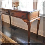 F25. 2 drawer wooden console table by Conant Ball Furniture. 27”h x 48”w x 17”d 